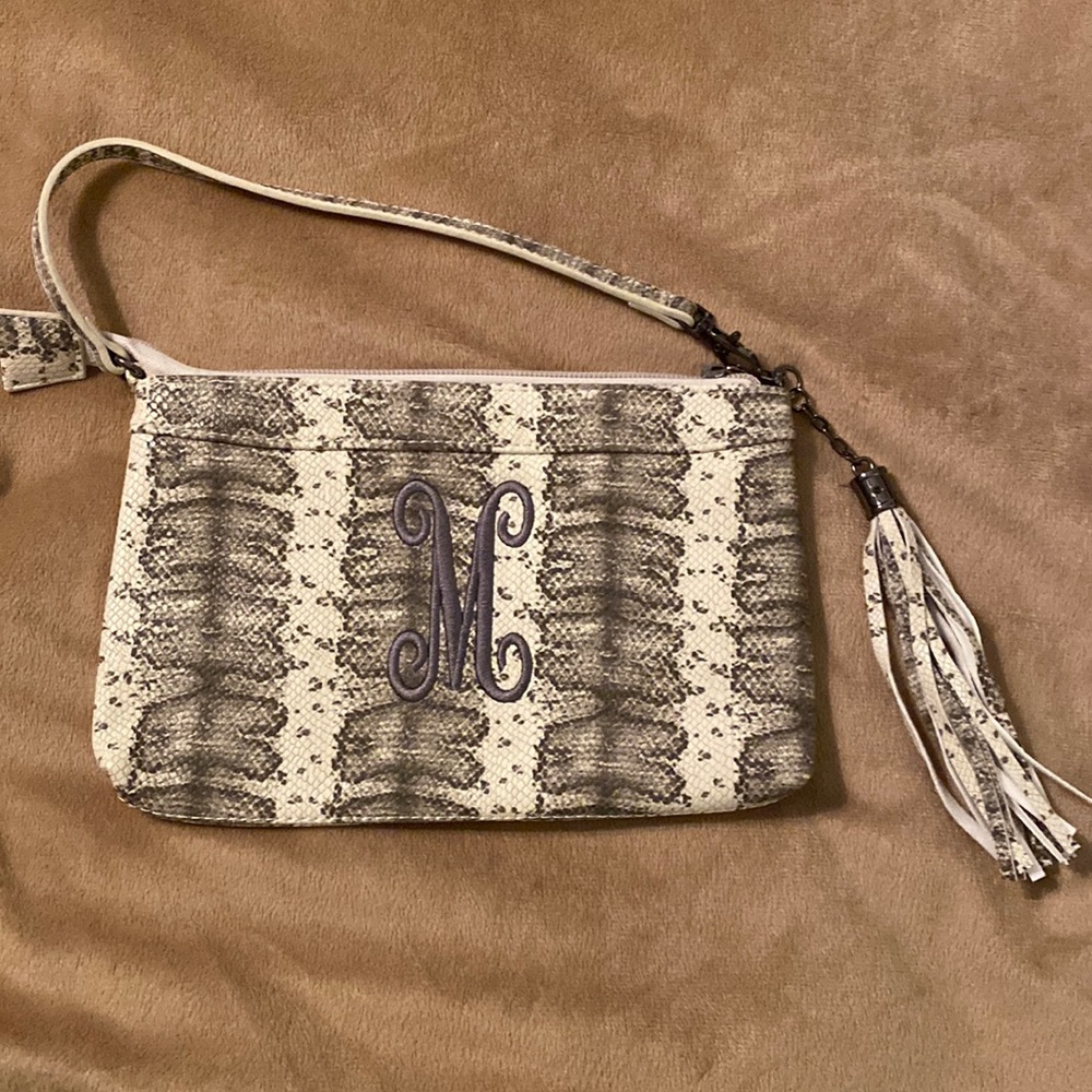 Faux snakeskin wristlet. Monogram M. Brand new and never used.